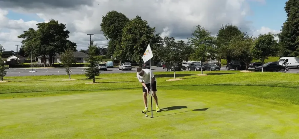 Speedgolfer putting on a green at Castlebar Golf Club