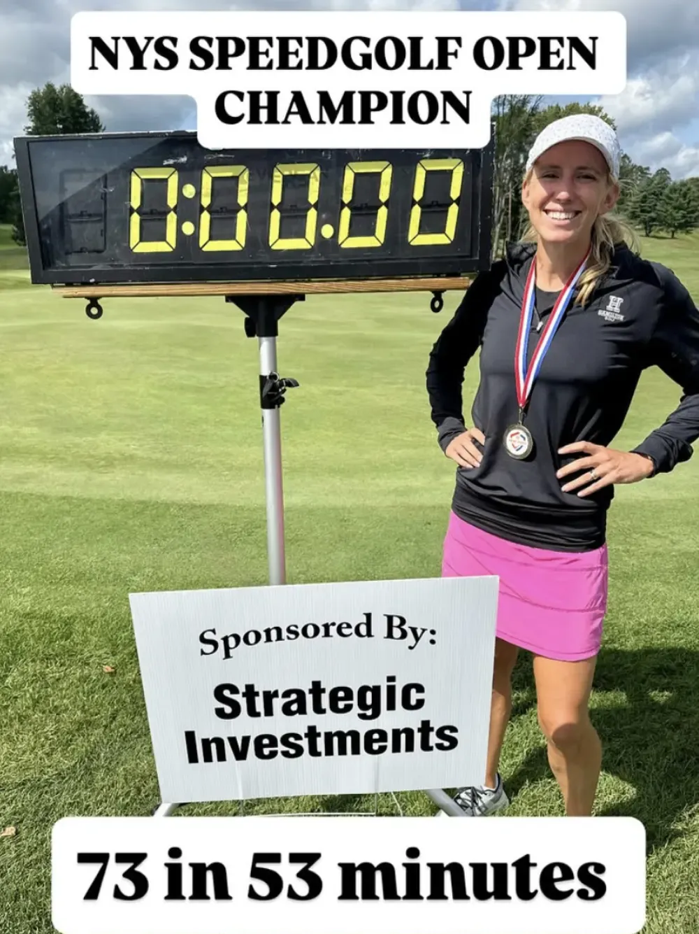 Lauren Cupp stands beside the New York State Speedgolf Open championship clock.