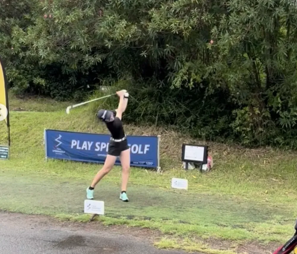 A speedgolfer hits a shot during a Japanese tournament.