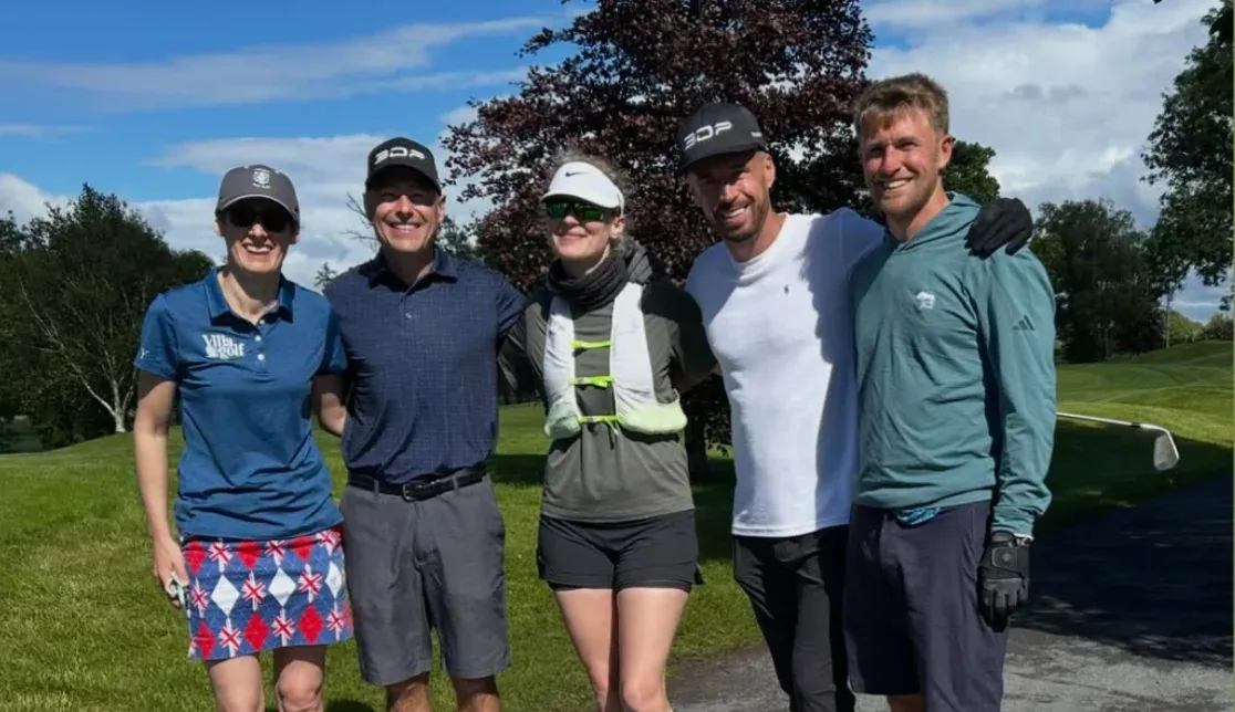 Speedgolfers posing together on a sunny golf course